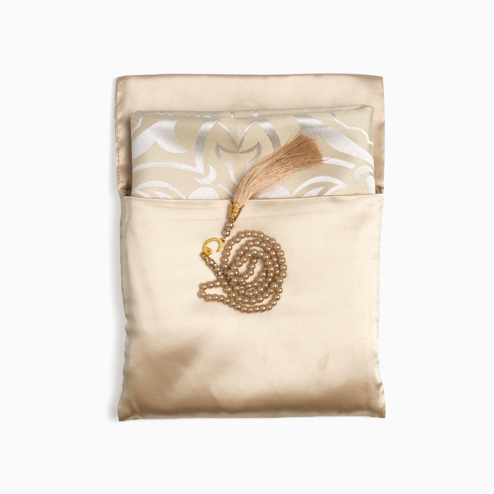 ebadat prayer mat in beige color in its pouch along with a matching prayer bead of same color