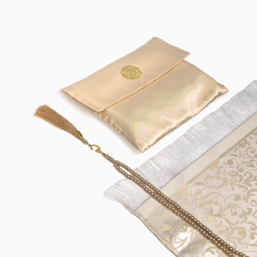 beige colored prayer mat with its pouch and matching beads