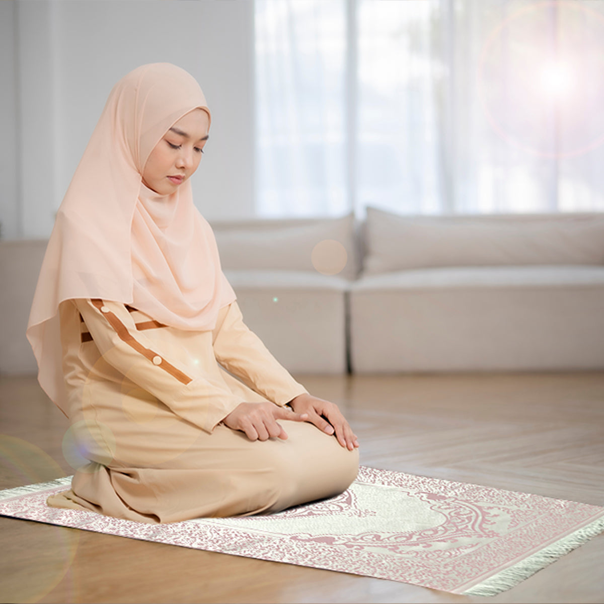 a woman praying on a pink gift prayer mat