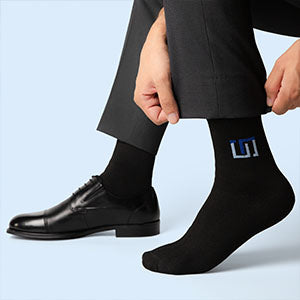 a man wearing black wudhu socks