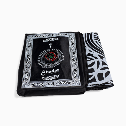 A black portable prayer mat by abdeez along with its pouch