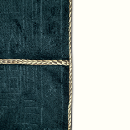 a close up view for a prayer rug in dark emerald green color