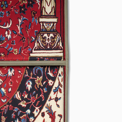 a close up view of lava red ebadat prayer rug