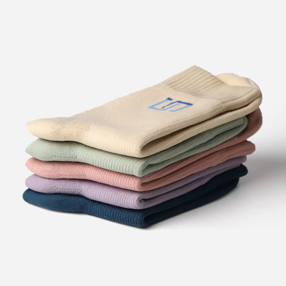 Stack of folded socks in various colors