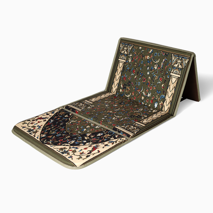 An earth green folded padded prayer rug with a beautfiul pattern, featuring a backrest