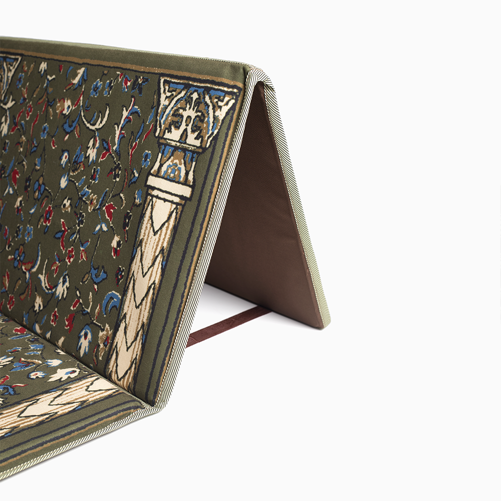 backrest of a green portable prayer rug
