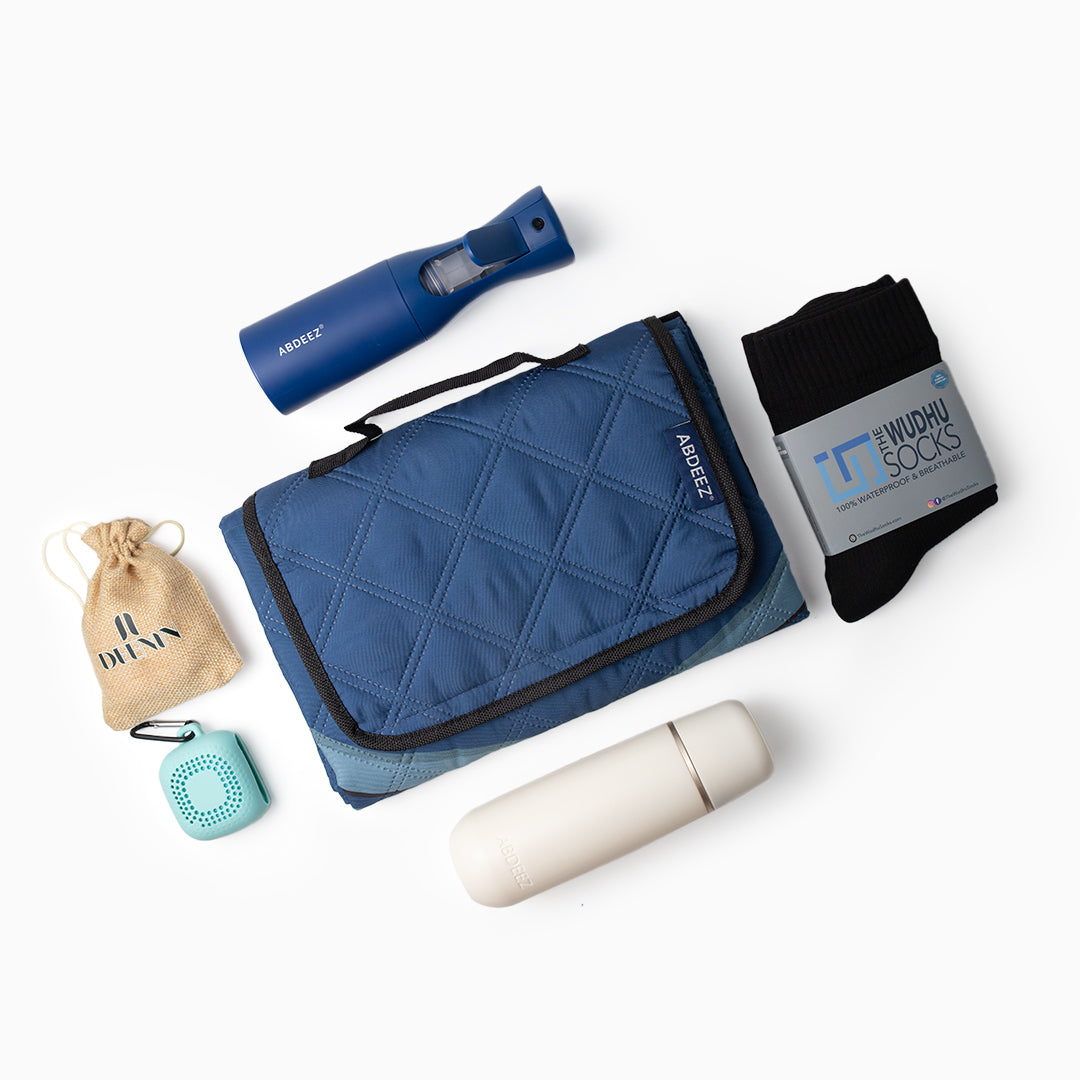 A top-down view of bundle including portable bidet, continuous wudhu spray, wudhu towel, the wudhu socks and SalahTrek™