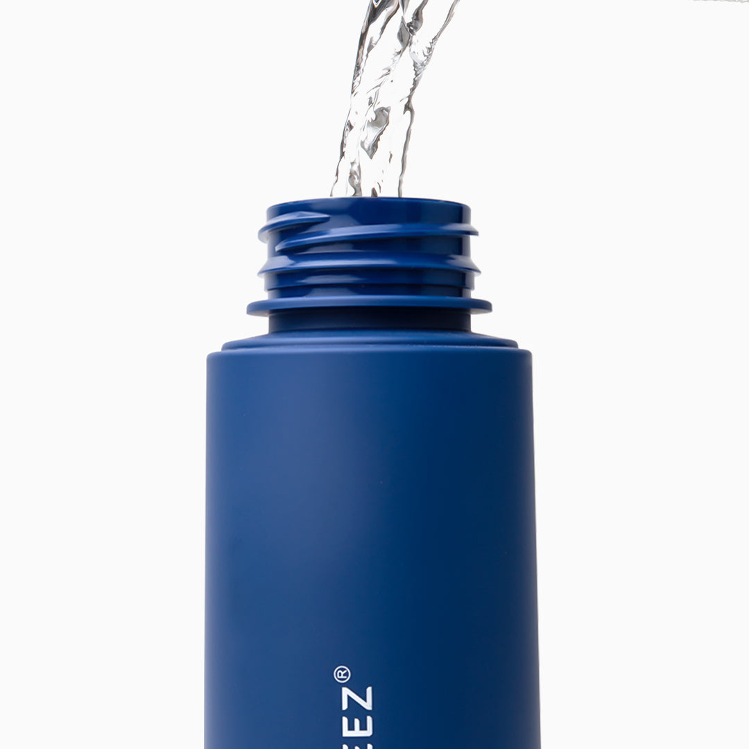 water being poured in wudhu spray bottle storage