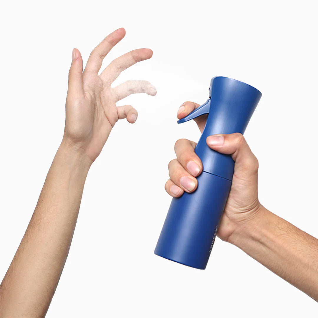 a continuous spray being performed on a hand by abdeez wudhu spray