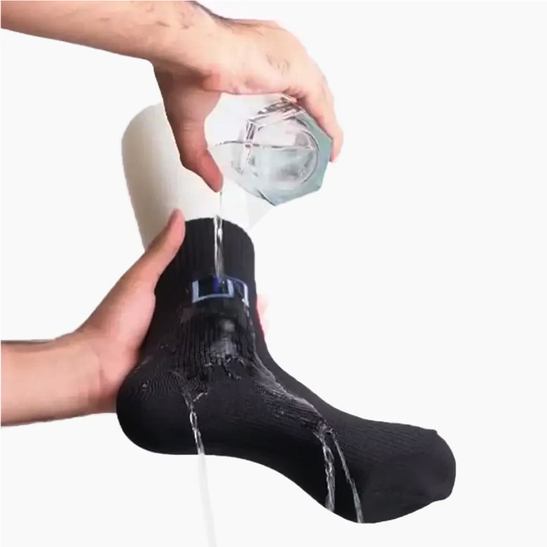 water dropping from glass on waterproof wudhu socks