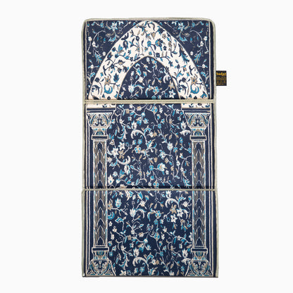 full view of blue ebadat prayer mat lying on the ground