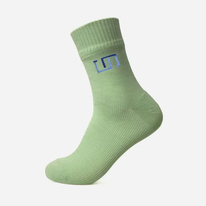pastel green sock with a white background