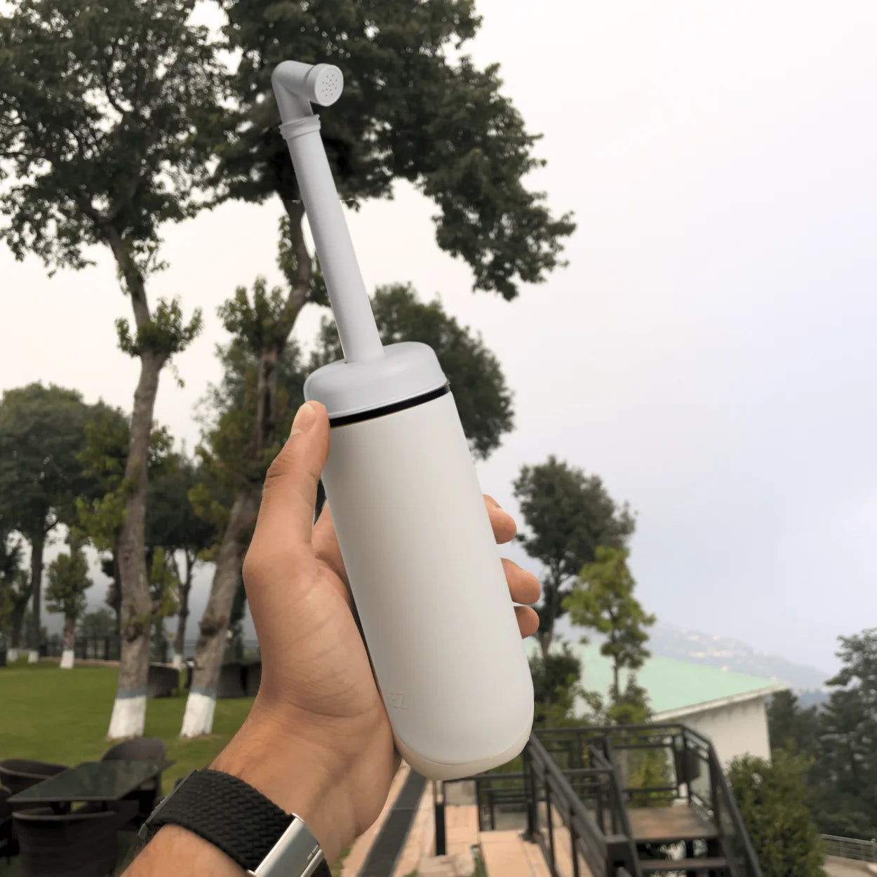 Portable bidet in held in hand