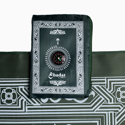 dark green prayer mat with pouch placed on it