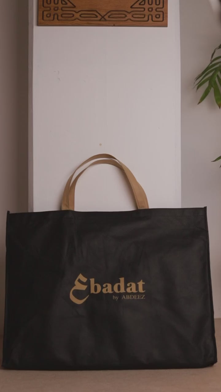 a demonstration on ebadat prayer rug on how to use it