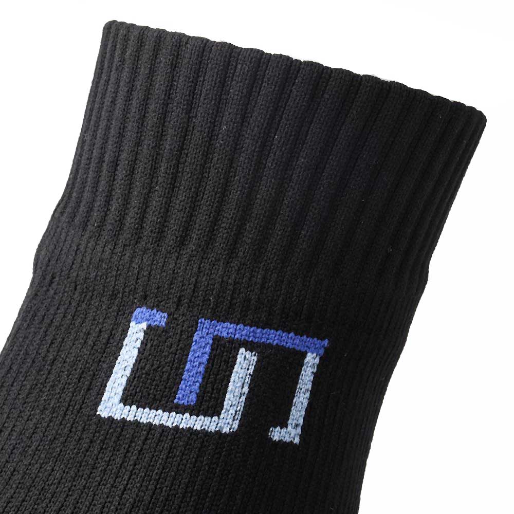 a close up view of the black wudhu sock with a logo on it