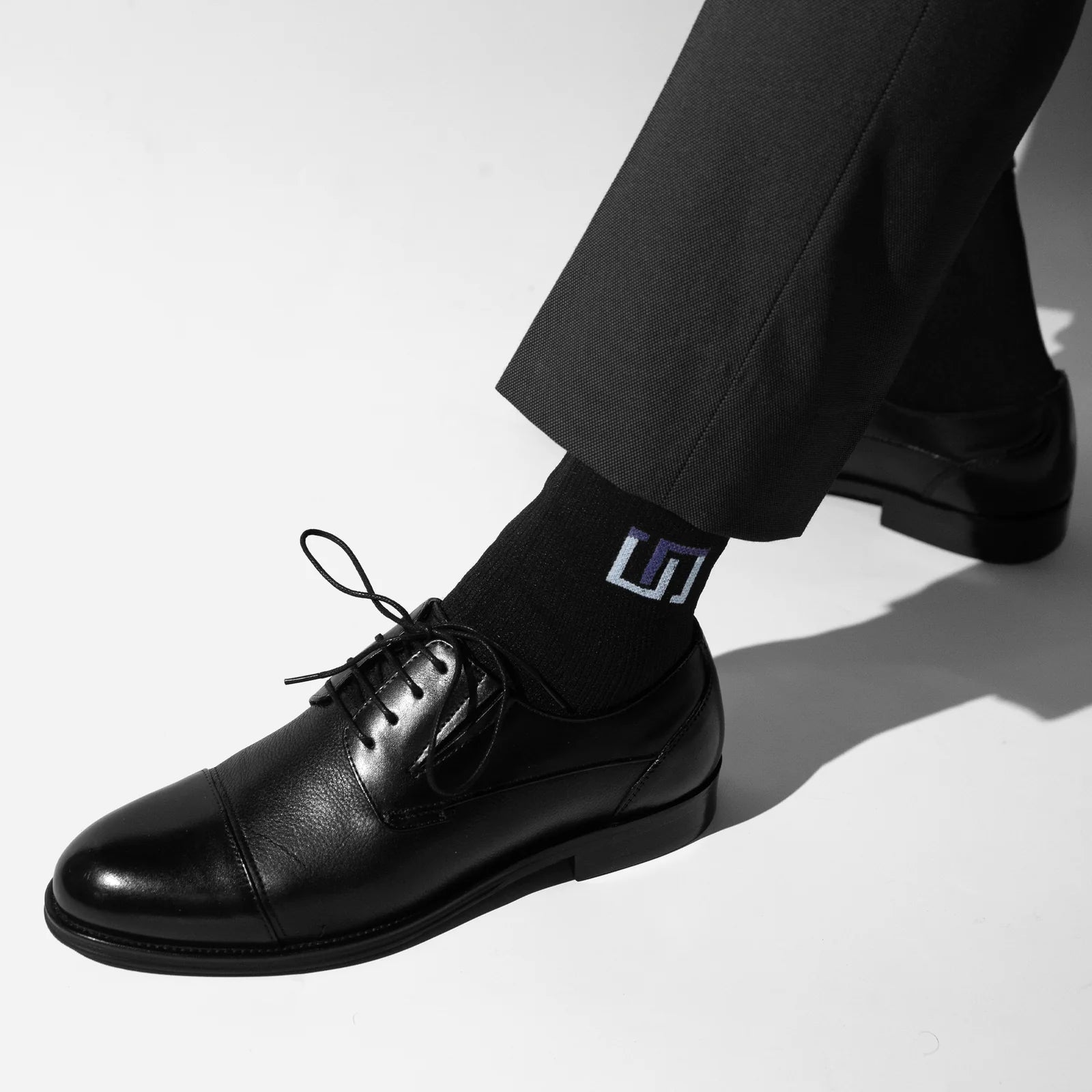 black wudhu socks in black shoes with formal black trouser